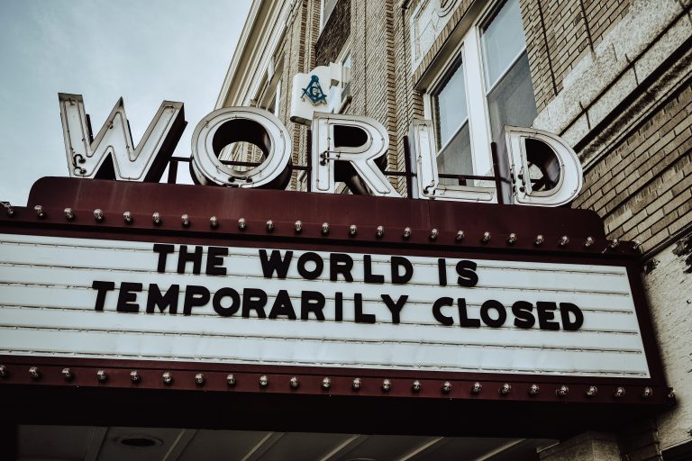Sign reading "The world is temporarily closed"